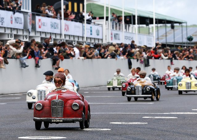 Children take part in the Settrington Cup Pedal Car Race as motoring enthusiasts attend the Goodwood Revival, a three-day historic car racing festival in Goodwood, near Chichester, Britain, on September 13, 2025. (Photo by Toby Melville/Reuters)