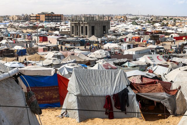 Tents sheltering Palestinians displaced by conflict are pictured in Khan Yunis in the southern Gaza Strip on September 22, 2025. In recent weeks, the Israeli military has launched a heavy air and ground assault on the Gaza Strip, an effort it says is aimed at eliminating Hamas fighters from the Palestinian territory's largest urban hub. (Photo by Omar Al-Qattaa/AFP Photo)