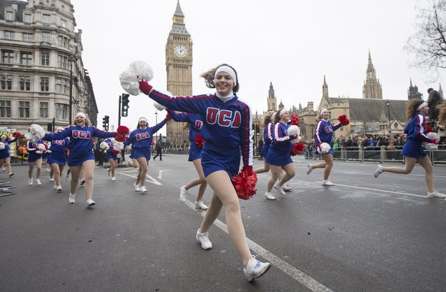 Members of the U.S. Universal Cheerleaders Association wave their pom-poms at the finish of the annual New Year's Day parade in London January 1, 2015. (Photo by Peter Nicholls/Reuters)