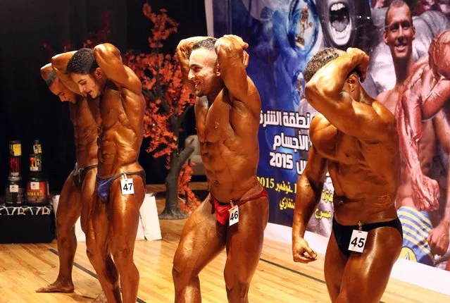 Libyan men compete in a bodybuilding competition in the eastern coastal city of Benghazi on November 19, 2015. (Photo by Abdullah Doma/AFP Photo)