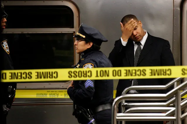 Members of the New York City police (NYPD) work at the scene after a commuter was pushed in front of a subway train as it arrived at Times Square in New York City, U.S., November 7, 2016. (Photo by Brendan McDermid/Reuters)