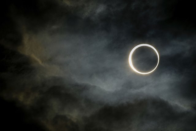 The moon moves past the sun during an annular solar eclipse in Puerto San Julian, Argentina, Wednesday, October 2, 2024. (Photo by Natacha Pisarenko/AP Photo)