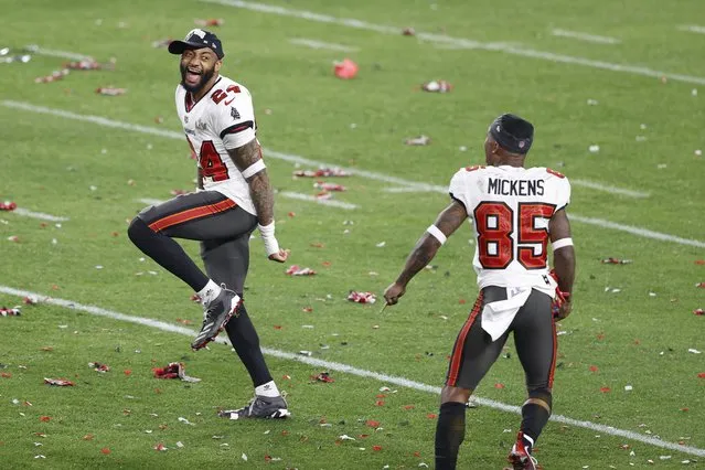 Tampa Bay Buccaneers cornerback Carlton Davis (24) and wide receiver Jaydon Mickens (85) celebrate after defeating the Kansas City Chiefs in Super Bowl LV at Raymond James Stadium on February 07, 2021 in Tampa, Florida. (Photo by Kim Klement/USA TODAY Sports)
