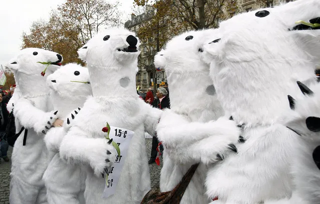 Environmentalist dressed in bear costumes demonstrate during the World Climate Change Conference 2015 (COP21) on December 12, 2015 in Paris, France. The first universal agreement on the climate has been proposed at the United Nations conference on climate change COP21 in Le Bourget. (Photo by Chesnot/Getty Images)