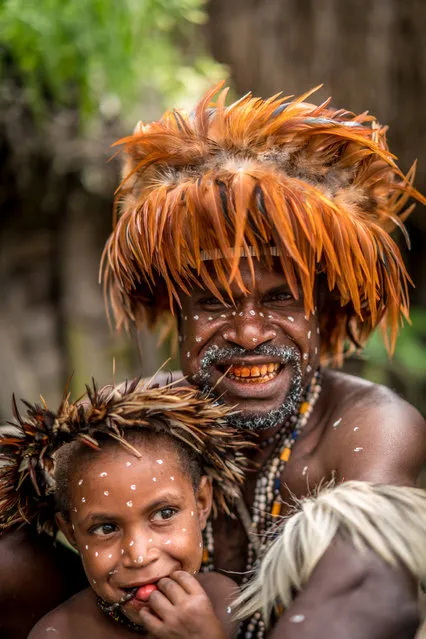 Dani tribe elder with younger member of the tribe IN, Western New Guinea, Indonesia, August 2016. (Photo by Teh Han Lin/Barcroft Images)