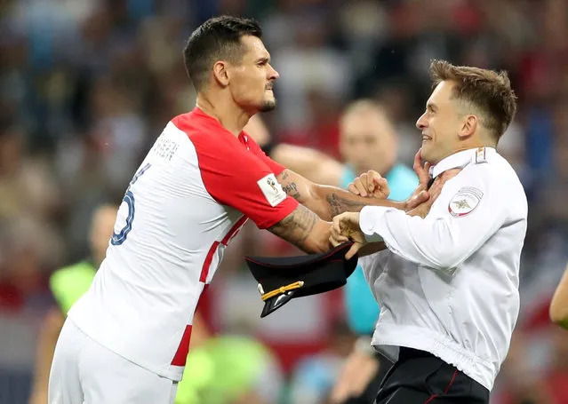 Croatia's Dejan Lovren clashes with a pitch invader during the FIFA World Cup 2018 Final at the Luzhniki Stadium, Moscow. Picture date 15 th July 2018. (Photo by Carl Recine/Reuters)