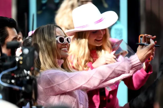 Margot Robbie poses for photos with fans during a “Barbie” fan event at Westfield Sydney on June 30, 2023 in Sydney, Australia. "Barbie", directed by Greta Gerwig, stars Margot Robbie, America Ferrera and Issa Rae, and will be released in Australia on July 20 this year. (Photo by James Gourley/Getty Images)