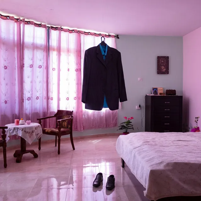 World Press Photo Story of the Year. Habibi. The dress and shoes of the prisoner Nael al-Barghouthi in his bedroom in Kobar, Palestine, in August 2015. His wife, Iman, keeps all her husband’s clothes, shoes and items in their home. Nael was arrested on 4 April 1978 after carrying out a commando operation in which one Israeli was killed. Released during Shalit’s agreement between Hamas and Israel in 2011, he has been arrested again and sentenced to life imprisonment. He has spent 41 years in prison and is the longest-serving Palestinian inmate in Israeli jails. Items left behind by inmates allow us to perceive the absence of men and to understand the emptiness they left in the life of their family members. (Photo by Antonio Faccilongo/World Press Photo 2021)