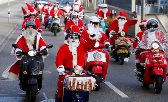 Members of a Vespa Fan Club dressed as Santa Claus (Samichlaus) ride on their scooters in Zurich, Switzerland December 4, 2016. (Photo by Arnd Wiegmann/Reuters)