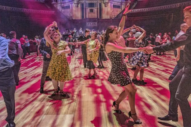 Members of the public enjoy a tea dance at the Royal Albert Hall in London, United Kingdom on April 12, 2022. (Photo by Sarah Lee/The Guardian)