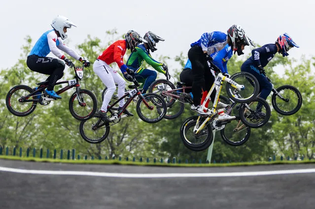 The field of competitors go over a jump during the Men's BMX semi finals at Parque Peñalolen on Day 2 of Santiago 2023 Pan Am Games on October 22, 2023 in Santiago, Chile. (Photo by Al Bello/Getty Images)