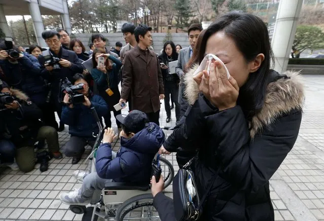 A family member of a victim of toxic humidifier disinfectants weeps during a press conference against court's sentence at the Seoul Central District Court in Seoul, South Korea, Friday, January 6, 2017. A South Korean court has sentenced the former head of Oxy Reckitt Benckiser to seven years in prison after the company's disinfectant for humidifiers killed scores of people. (Photo by Ahn Young-joon/AP Photo)