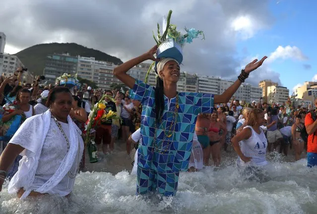 Believers of Afro-Brazilian religions pay tribute to Yemanja, goddess of the sea, during a traditional celebration ahead of New Year's eve on Copacabana Beach in Rio de Janeiro, Brazil December 29, 2018. (Photo by Pilar Olivares/Reuters)