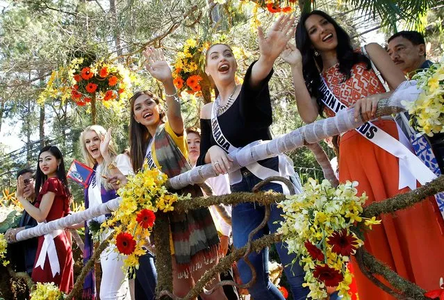 Miss Universe contestants wave to the crowd while onboard a float during their arrival and parade in Baguio city, north of Manila, Philippines January 18, 2017. Pictured are (from left): Sari Nakazawa, Miss Japan, Christina Waage, Miss Norway, Muneka Joy Cruz Taisipic, Miss Guam, Siera Bearchell, Miss Canada and Carolyn Carter, Miss U.S. Virgin Islands. (Photo by Harley Palanchao/Reuters)