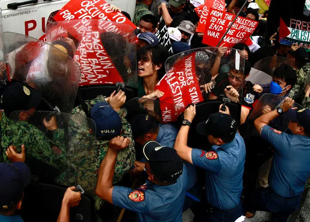Filipino protesters scuffle with police during a pro-Palestinian protest near the US Embassy in Manila, Philippines on November 14, 2023. Demonstrators marched to the US Embassy to denounce the US government's role in the Israel-Hamas conflict. Thousands of Israelis and Palestinians have died since the militant group Hamas launched an unprecedented attack on Israel from the Gaza Strip on 07 October, and the Israeli strikes on the Palestinian enclave which followed it. (Photo by Francis R. Malasig/EPA/EFE)