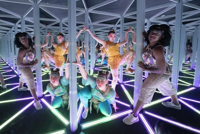 (L-R) Sophie Douglas, Caitlin Anderson and Emmanuella Damptey, who play aliens from the planet Hanyana in the Edinburgh Fringe show WeCameToDance, explore the giant kaleidoscope at Camera Obscura & World of Illusions, Edinburgh, Scotland on Thursday, August 26, 2021. (Photo by Jane Barlow/PA Images via Getty Images)