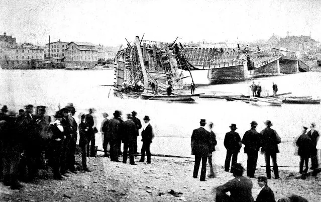 In this photo provided by Lee County Historical and Genealogical Society, people gather near the Truesdell Bridge in Dixon, Ill., following its collapse in 1873. It's been 150 years since the bridge collapsed, remaining the worst road-bridge disaster in American history. On May 4, 1873, a crowd of more than 200 gathered on the bridge to watch a baptism when it toppled over, trapping dozens of victims just inches below the river's surface. The disaster claimed 46 lives and injured dozens of others. (Photo by Charles Keyes/Lee County Historical and Genealogical Society via AP Photo)