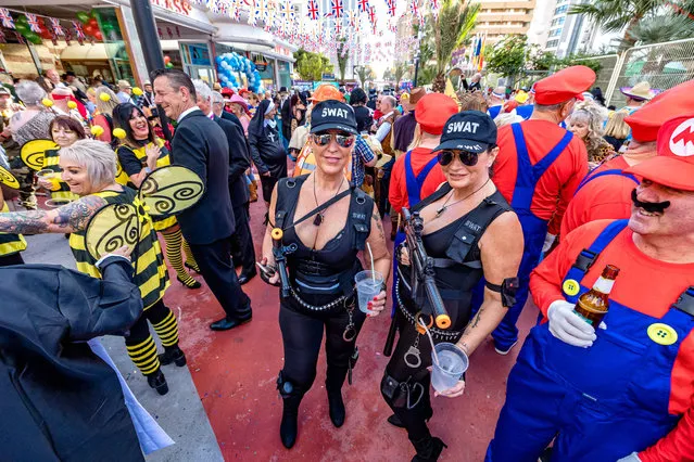 British tourists are disguised as they take part in “Fancy Dress Party” event in the seaside resort of Benidorm on the eastern coast of Spain, on November 18, 2021. (Photo by Solarpix)