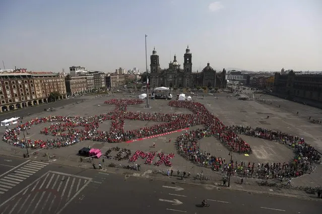 Cyclists gather to form a shape of a bicycle with the aim of promoting cycling as a mode of transport and to commemorate Bicycle Day, which is celebrated April 19 annually, at Zocalo square in Mexico City, Mexico, April 10, 2016. (Photo by Edgard Garrido/Reuters)