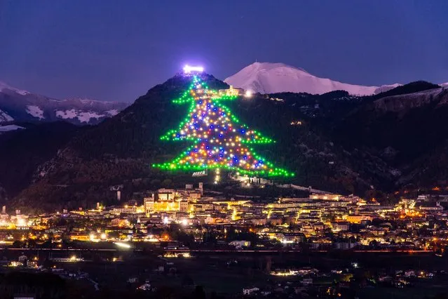 A Christmass tree shaped lighting decorates the slopes of Mount Ingino in Gubbio, Perugia district, central Italy on December 13, 2021. This world’s largest Christmas tree, has held the world record since 1991. It is 750 metres tall and 450 metres wide. (Photo by CICO/ROPI via ZUMA Press Wire/EYEVINE)