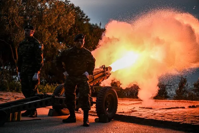 Greek Army soldiers fire a 21-gun salute on the morning of the celebrations of the Greek Independence Day on Lycabettus hill in Athens, on March 25, 2024. (Photo by Theophile Bloudanis/AFP Photo)