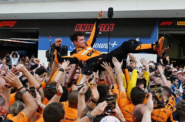 McLaren's British driver Lando Norris is tossed in the air as his team celebrates his victory in the 2024 Miami Formula One Grand Prix at Miami International Autodrome in Miami Gardens, Florida, on May 5, 2024. (Photo by Giorgio Viera/AFP Photo)