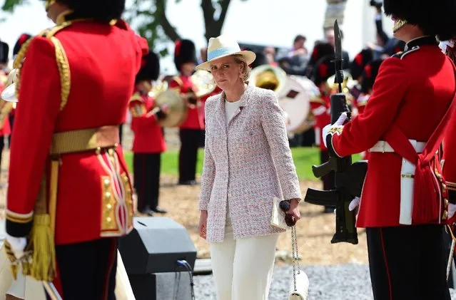 Belgium's Princess Astrid, center, arrives for the ceremonial opening of Hougoumont Farm in Braine-l'Alleud, near Waterloo, Belgium on Wednesday, June 17, 2015. Hougoumont Farm played a critical role in the outcome of the Battle of Waterloo, and the newly restored farm will open to the general public on June 18, 2015. (AP Photo/Emmanuel Dunand/Pool Photo via AP)