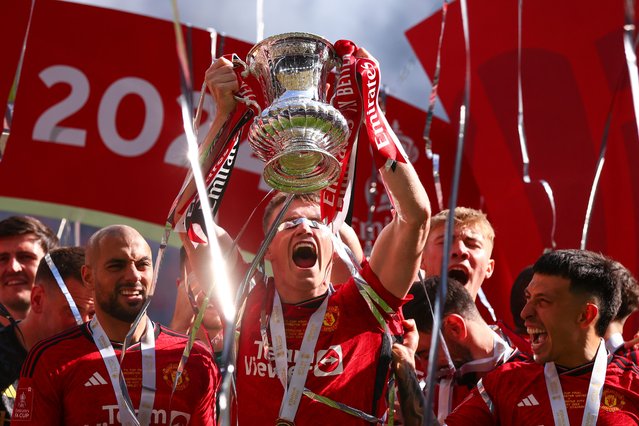 Scott McTominay of Manchester United celebrates with the trophy during the Emirates FA Cup Final match between Manchester City and Manchester United at Wembley Stadium on May 25, 2024 in London, England. (Photo by Marc Atkins/Getty Images)
