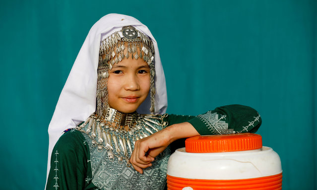 A Hazara girl with traditional jewellery poses for a photograph during a practice ahead of the Hazara Culture Day at the Qayum Papa Stadium in Mariabad, Quetta, Pakistan, June 21, 2019. The Quetta community held its first Hazara Culture Day to celebrate and showcase its history, music and traditions. (Photo by Akhtar Soomro/Reuters)