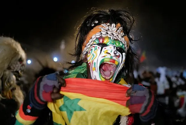 Senegal’s fans celebrate after winning the Africa Cup of Nations 2021 final match between Egypt and Senegal in Dakar, Senegal on February 6, 2022. (Photo by Zohra Bensemra/Reuters)