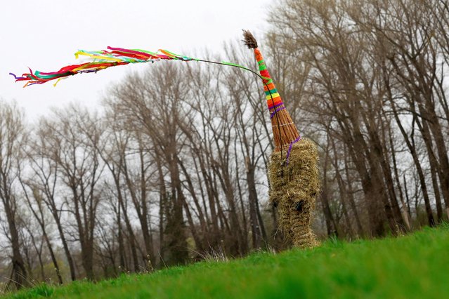 A boy dressed in a hay suit walks through the village as a part of an Easter celebration called 'Marching Judas' in the village of Stradoun near Vysoke Myto, Czech Republic, on March 30, 2024. (Photo by David W. Cerny/Reuters)