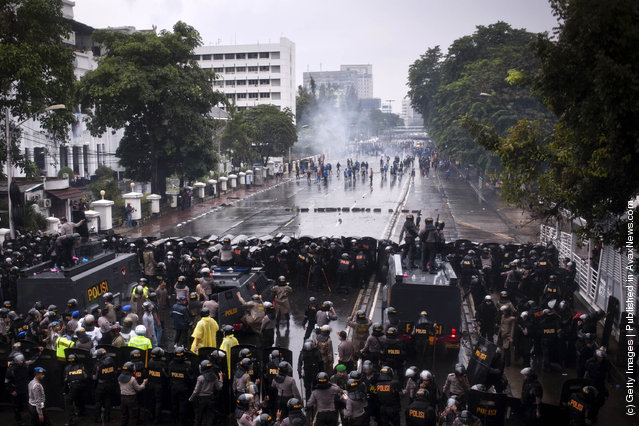Indonesian students clash with police during protests against planned fuel price hikes in Jakarta, Indonesia