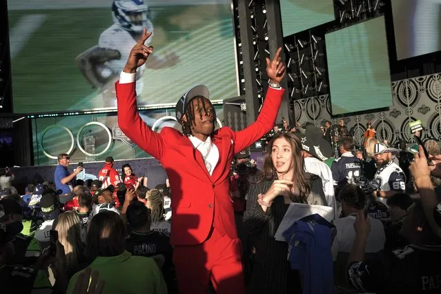 Alabama wide receiver Jameson Williams celebrates after being chosen by the Detroit Lions with the 12th pick of the NFL football draft Thursday, April 28, 2022, in Las Vegas. (Photo by Jae C. Hong/AP Photo)