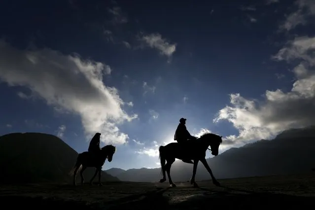 Hindu villagers ride a horse at Mount Bromo ahead of the annual Kasada festival in Indonesia's East Java province, July 30, 2015. (Photo by Reuters/Beawiharta)