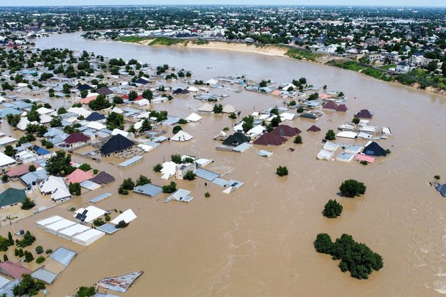 Houses are partially submerged following a dam collapse in Maiduguri, Nigeria, Tuesday, September 10, 2024. (Photo by Musa Ajit Borno/AP Photos)