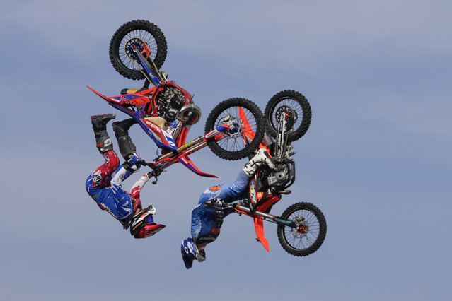 Riders perform during a freestyle motocross show at the EICMA exhibition motorcycle fair in Rho, outskirt of Milan, Italy, Thursday, November 7, 2024. (Photo by Luca Bruno/AP Photo)