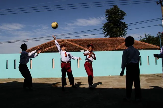 Students playing a ball on the first day of school at SDN Neglasari, Sumedang Regency on July 18, 2022. On the first day of school, students undergo an introductory period of the school environment filled with introductions between students, teachers, and the school environment in the new school year 2022/2023. (Photo by Algi Febri Sugita/ZUMA Press Wire/Rex Features/Shutterstock)