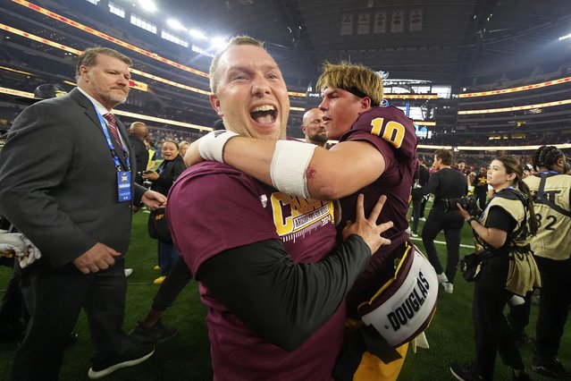 Ariona State head coach Kenny Dillingham, left, and quarterback Sam Leavitt, right, celebrate after the team's win in the Big 12 Conference championship NCAA college football game against Iowa State, in Arlington, Texas, Saturday December 7, 2024. (Photo by Julio Cortez/AP Photo)