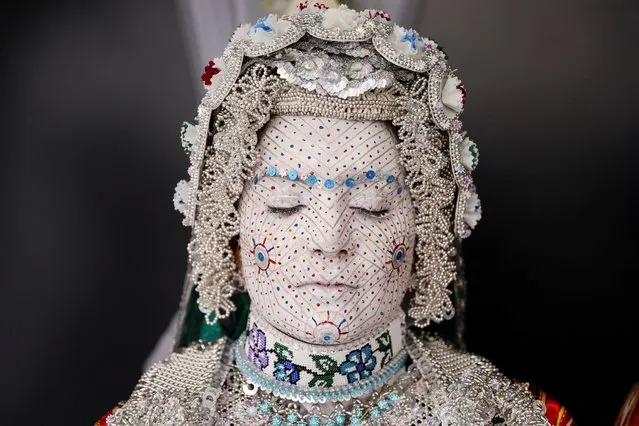 Melissa Guerrero, a U.S. citizen of Mexican origin, wears traditional wedding makeup and a traditional costume during her wedding ceremony in the village Donje Ljubinje, near Prizren, Kosovo on August 5, 2022. (Photo by Fatos Bytyci/Reuters)