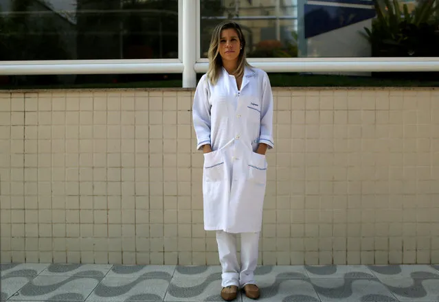 Danielle Bhering, a 32-year-old nurse, poses for a portrait in Rio de Janeiro, Brazil, July 23, 2016. When asked what she felt about Rio de Janeiro hosting the Olympics, Danielle said, “I'm unhappy with the Olympics at a time when the country is living with violence, I don't want to leave my home during the games”. She also said, “It is difficult to accept this huge event with our polluted Guanabara Bay and the violence in the city”. (Photo by Pilar Olivares/Reuters)