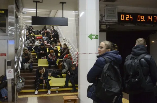 People shelter inside a metro station after a shelling in Kyiv (Kiev), Ukraine, 31 October 2022, amid the ongoing Russian invasion. Explosions have been reported in several districts around Ukraine on 31 October. Kyiv Mayor Vitali Klitschko said on social media that power engineers were working to restore electricity supply after damage to an energy facility that powers around 350,000 apartments in Kyiv. Some parts of the city were left with no water as a result of strikes on critical infrastructure facilities, the mayor added. (Photo by Andrii Nesterenko/EPA/EFE)