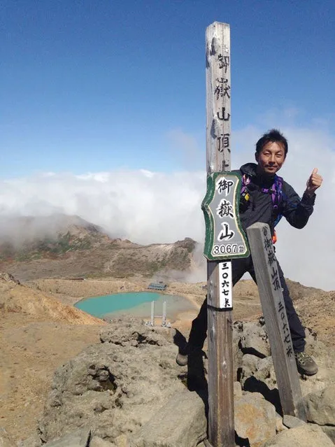 In this Saturday, September 27, 2014 photo found in a smart phone possessed by 41-year-old hiker Hideomi Takahashi who fell victim to the eruption of Mount Ontake, and was uploaded on twitter by his friend Thursday, October 2, Takahashi poses on the summit of Mount Ontake four minutes before the initial eruption of the volcanic mountain in central Japan. (Photo by Courtesy Hideomi Takahashi/AP Photo)