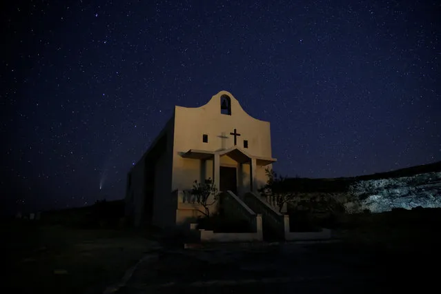 The Comet C/2020 or “Neowise” is seen behind St Anne Chapel at Dwejra, outside the village of San Lawrenz on the island of Gozo, Malta on July 22, 2020. (Photo by Darrin Zammit Lupi/Reuters)