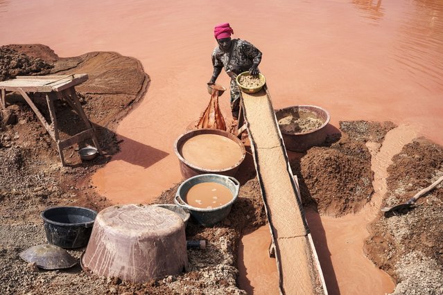 A woman processes gold at a mining site in the Kedougou region of Senegal on Thursday, January 16, 2025. (Photo by Annika Hammerschlag/AP Photo)