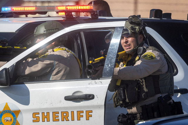 Los Angeles County Sheriff's deputies hold non-lethal weapons during a standoff between protesters and law enforcement in the Los Angeles County city of Paramount, California, on June 7, 2025. (Photo by Barbara Davidson/Reuters)