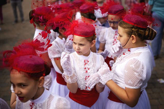 Students of a dance school wait outside Romania's Palace of Parliament during a series of events marking International Children's Day in Bucharest, Romania, Sunday, June 1, 2025. (Photo by Andreea Alexandru/AP Photo)