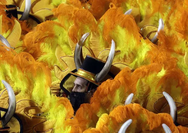 Revellers of the Unidos da Tijuca samba school participate in the annual carnival parade at Rio de Janeiro's Sambadrome, February 10, 2013. (Photo by Ricardo Moraes/Reuters)