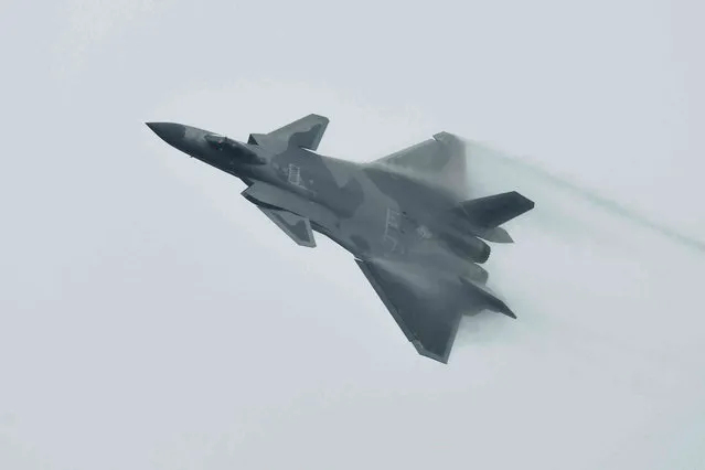 A J-20 stealth fighter jet performs during the 14th China International Aviation and Aerospace Exhibition in Zhuhai in southern China's Guangdong province, Tuesday, November 8, 2022. China is displaying its latest generation fighter jets and civilian aircraft this week as it looks to carve a larger role for itself in the global arms trade and compete with Boeing and Airbus. (Photo by Chinatopix via AP Photo)
