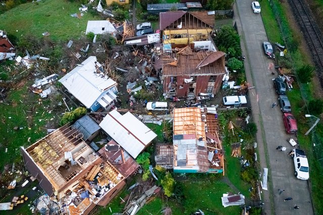 An aerial view shows the destruction caused by a tornado in Puerto Varas, Chile, 25 May 2025. More than fifteen thousand homes remain without electricity and other basic supplies in the tourist city of Puerto Varas, in southern Chile, after being hit by a tornado that destroyed more than a hundred houses and left a dozen injured. (Photo by Felipe Constanzo/EPA