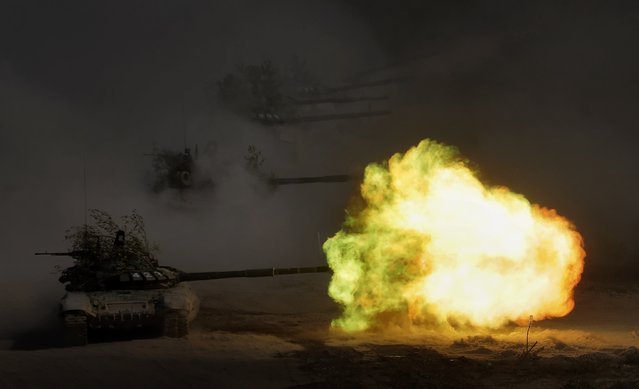 A Russian tank T-72B3 fires during the Kavkaz-2020 (The Caucasus 2020) military exercises at the range Raevsky in Krasnodar region, Russia, 23 September 2020. The Caucasus 2020 strategic command and staff exercise involving Russian Armed Forces and military troops from other countries take place from 21 to 26 September at the Russian internal ranges of the Southern Military District and in the waters of the Black and Caspian seas. (Photo by Maxim Shipenkov/EPA/EFE)